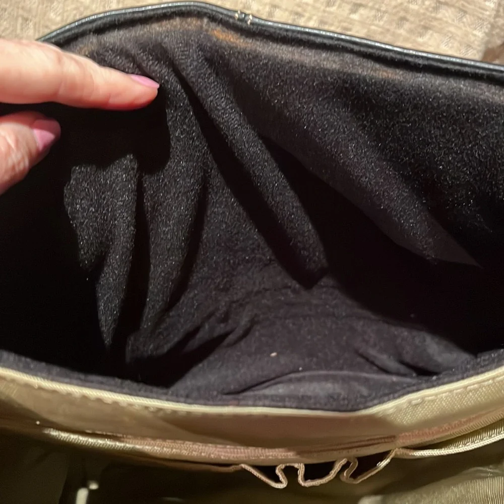 The territory ahead, black with brown leather trim, laptop bag